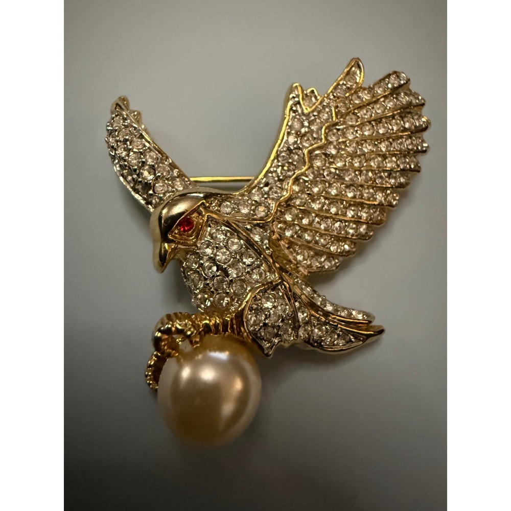 Vintage AD 2001 Gold Tone Pave Crystal Eagle Brooch with Faux Pearl and Red Eye